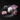 Dulenn modular sculptural candle components laid out on dark marble — white Buddha head base, navy geometric faceted wax piece, pink ribbed disc rings, and pink acrylic tray